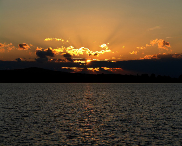 Sunset over water clouds boat free wallpaper - medium preview image