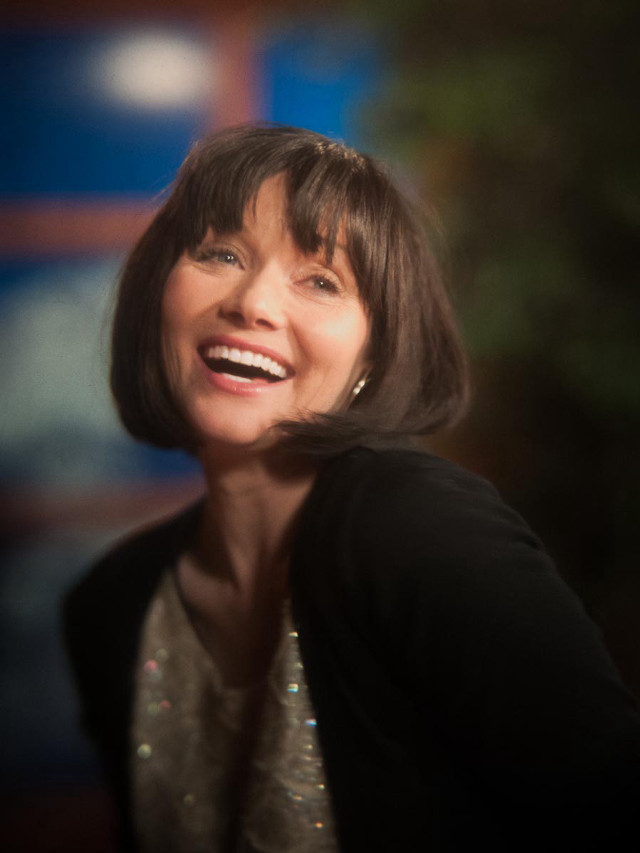 Woman smiling black jacket white free wallpaper - medium preview image