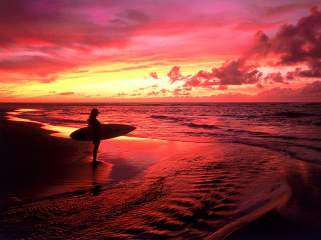 Person holding surfboard beach sunset #2 free wallpaper - medium preview image