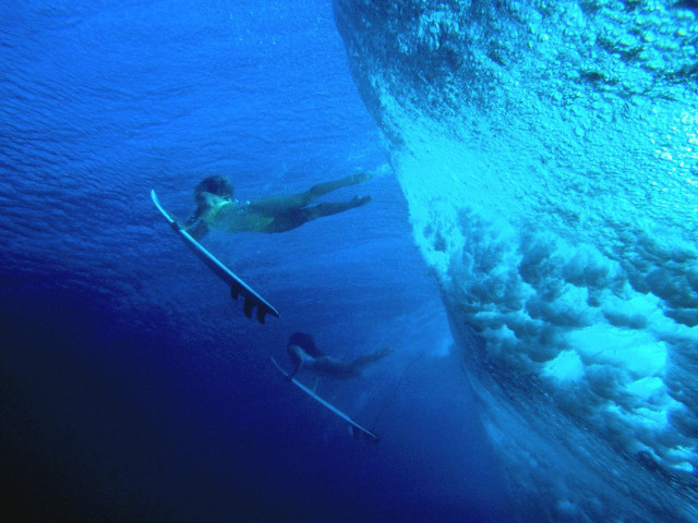 Man swimming ocean surfboard wave free wallpaper - medium preview image