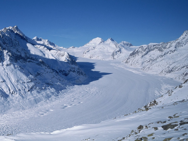 Skier snowy mountain slope view free wallpaper - medium preview image
