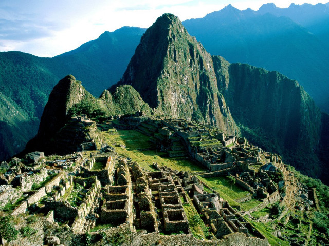 Mountain tall grassy area buildings free wallpaper - medium preview image