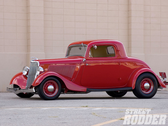 Red car parked building street free wallpaper - medium preview image