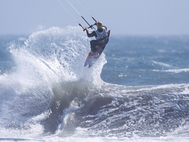 Man riding wave surfboard ocean #25 free wallpaper - medium preview image