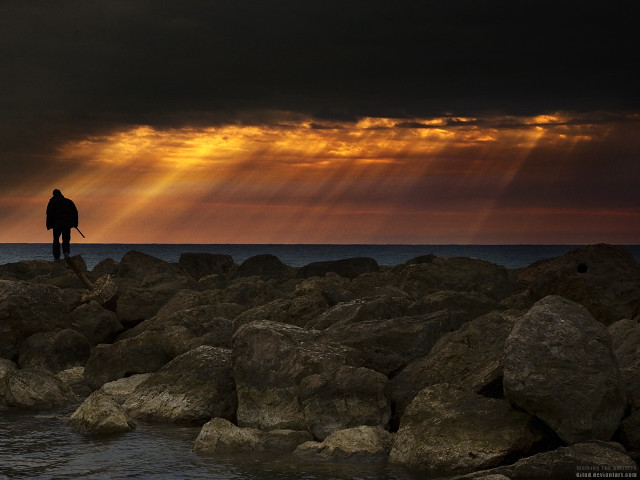 Man rock formation ocean sun free wallpaper - medium preview image