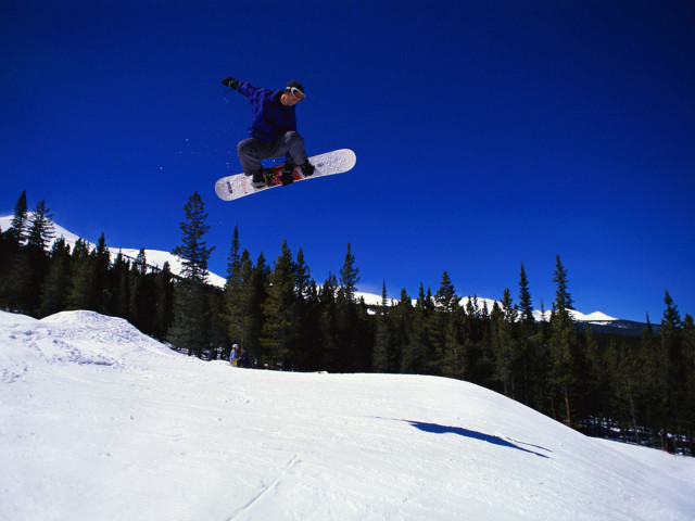 Man flying snowboard slope forest free wallpaper - medium preview image