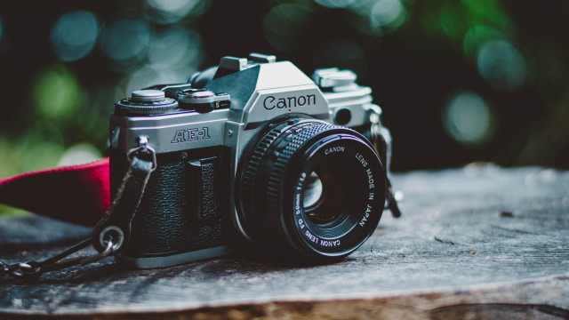 Camera wooden surface red strap free wallpaper - medium preview image