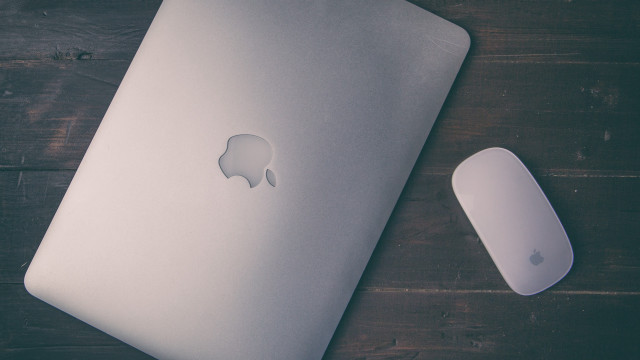 White apple laptop wooden table free wallpaper - medium preview image