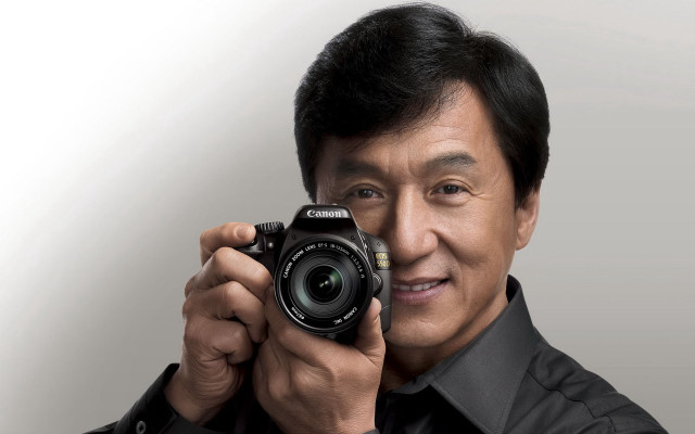 Man camera smile black shirt free wallpaper - medium preview image