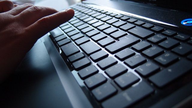 Person typing computer keyboard hand free wallpaper - medium preview image