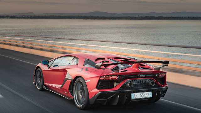 Red sports car highway ocean free wallpaper - medium preview image