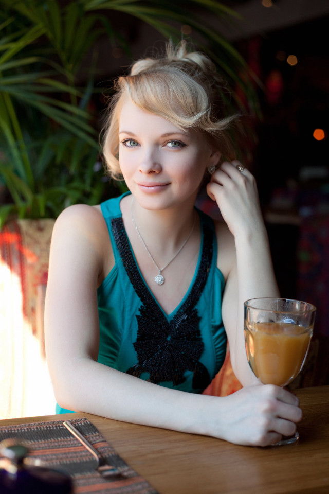 Woman sitting table orange juice #3 free wallpaper - medium preview image