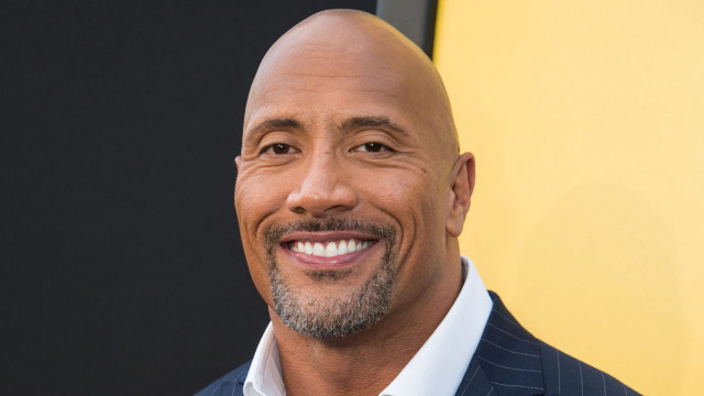 Bald man smiling suit yellow free wallpaper - medium preview image