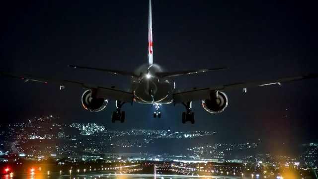 Jetliner night city lights flying free wallpaper - medium preview image