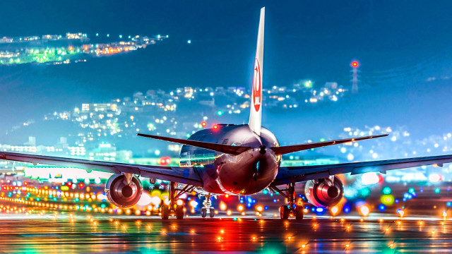 Jetliner night runway city lights free wallpaper - medium preview image