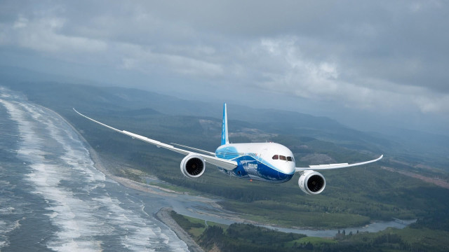 Jetliner greenhills beach ocean cloudy free wallpaper - medium preview image