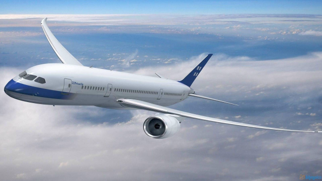 Large jetliner flying cloudy blue free wallpaper - medium preview image