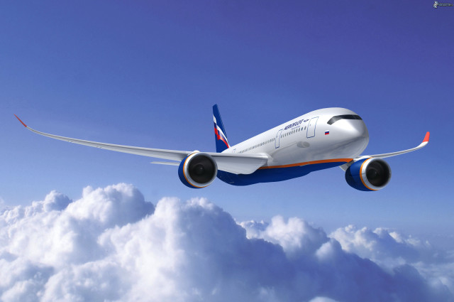 Large jetliner blue sky above free wallpaper - medium preview image