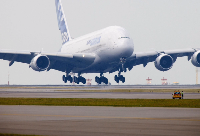 Jetliner taking off airport runway free wallpaper - medium preview image