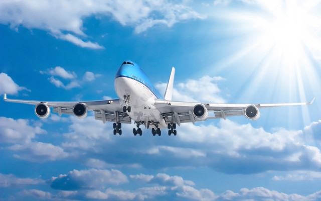 Jetliner flying blue sky clouds #15 free wallpaper - medium preview image