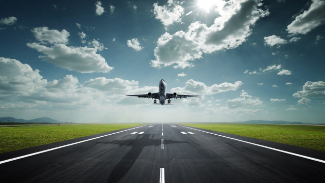 Plane flying runway sky clouds free wallpaper - medium preview image