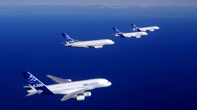 Four airplanes flying blue sky free wallpaper - medium preview image