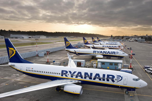 Airplanes parked runway airport cloudy free wallpaper - medium preview image