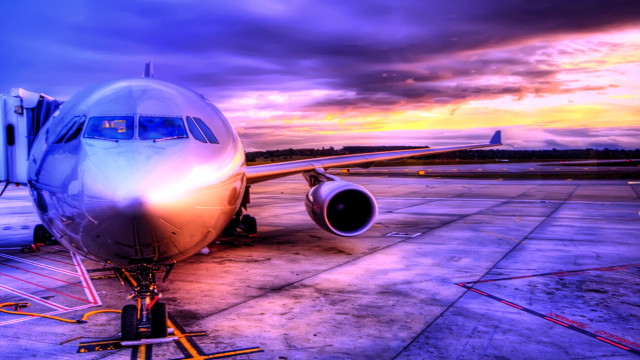 Plane parked runway airport sunset free wallpaper - medium preview image