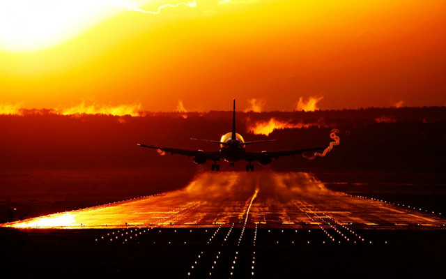 Plane takeoff sunset backlit cityscape free wallpaper - medium preview image