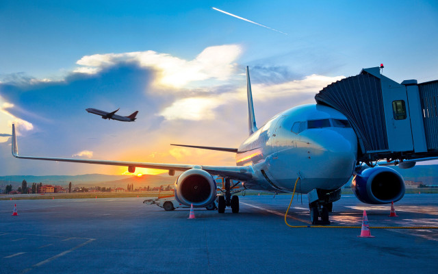 Plane parked runway sunset background free wallpaper - medium preview image