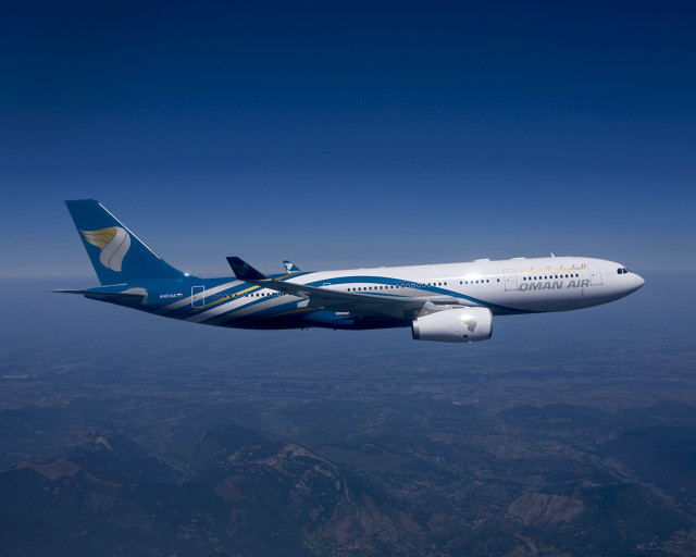 Jetliner flying blue sky mountain free wallpaper - medium preview image