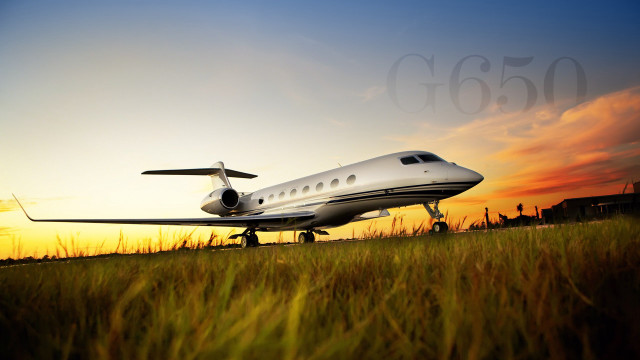 Small plane parked grass sunset free wallpaper - medium preview image