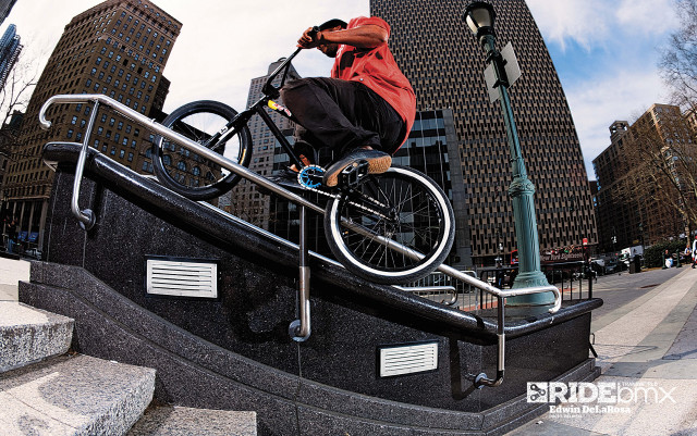Man bike handrail streetlight building free wallpaper - medium preview image