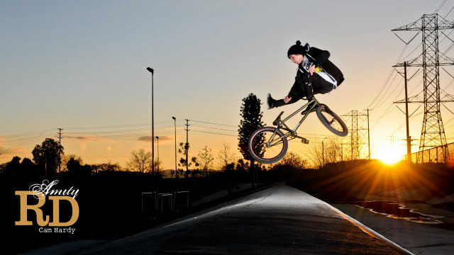 Man riding bike ramp sunset free wallpaper - medium preview image