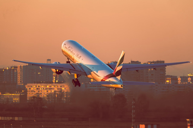 Jetliner cloudy sky city sunset free wallpaper - medium preview image