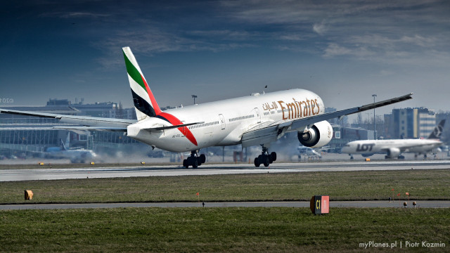 Jetliner takeoff runway city cloudy free wallpaper - medium preview image