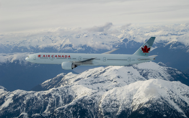 Canadian airplane flying mountain range free wallpaper - medium preview image