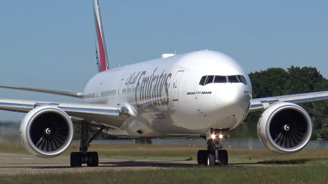 Jetliner airport runway forest trees free wallpaper - medium preview image