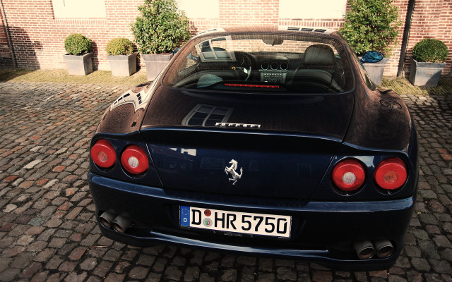 Black sports car brick building #2 free wallpaper - medium preview image