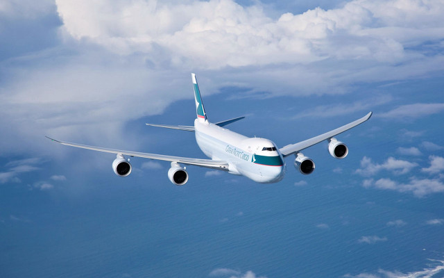 Large jetliner flying cloudy blue #2 free wallpaper - medium preview image