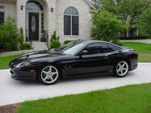 Black sports car driveway house free wallpaper - medium preview image