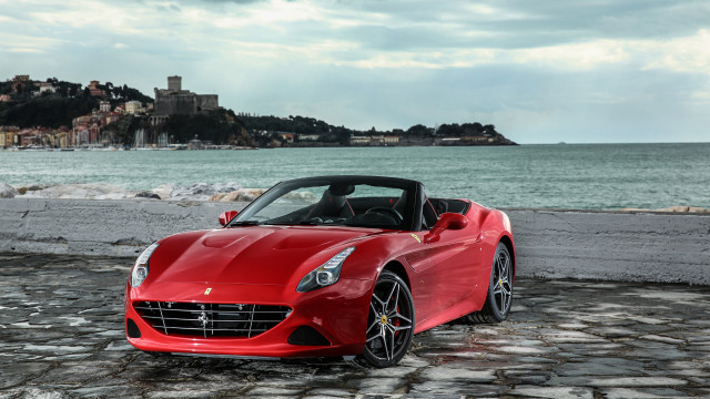 Red sports car cobblestone road free wallpaper for desktop - medium preview image