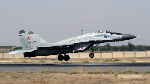 Fighter jet takeoff airport fence free wallpaper - medium preview image