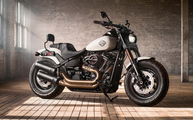 Motorcycle parked brick wall window free wallpaper - medium preview image