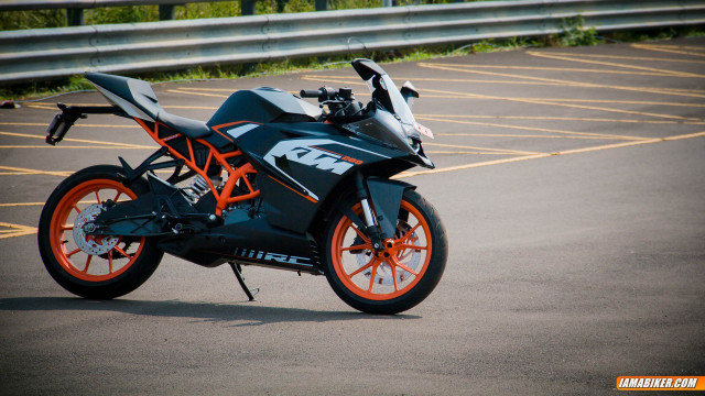 Motorcycle parked parking lot fence free wallpaper - medium preview image