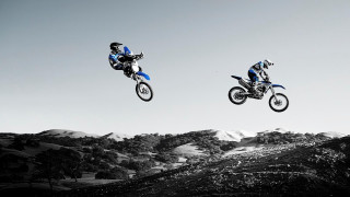 Motorcycles flying over mountains reflection - two person free wallpaper