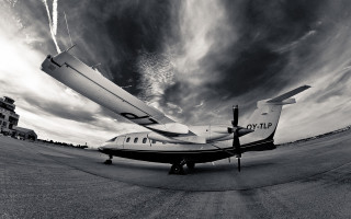 Small plane tarmac cloudy sky - a small plane free wallpaper