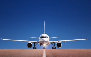 Large jetliner blue sky runway - turnaround free wallpaper