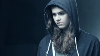 Woman hooded sweatshirt serious look - video art free wallpaper