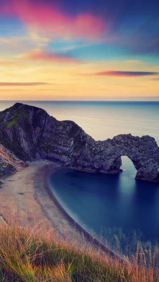 Sunset beach rock arch ocean - a matte painting free wallpaper